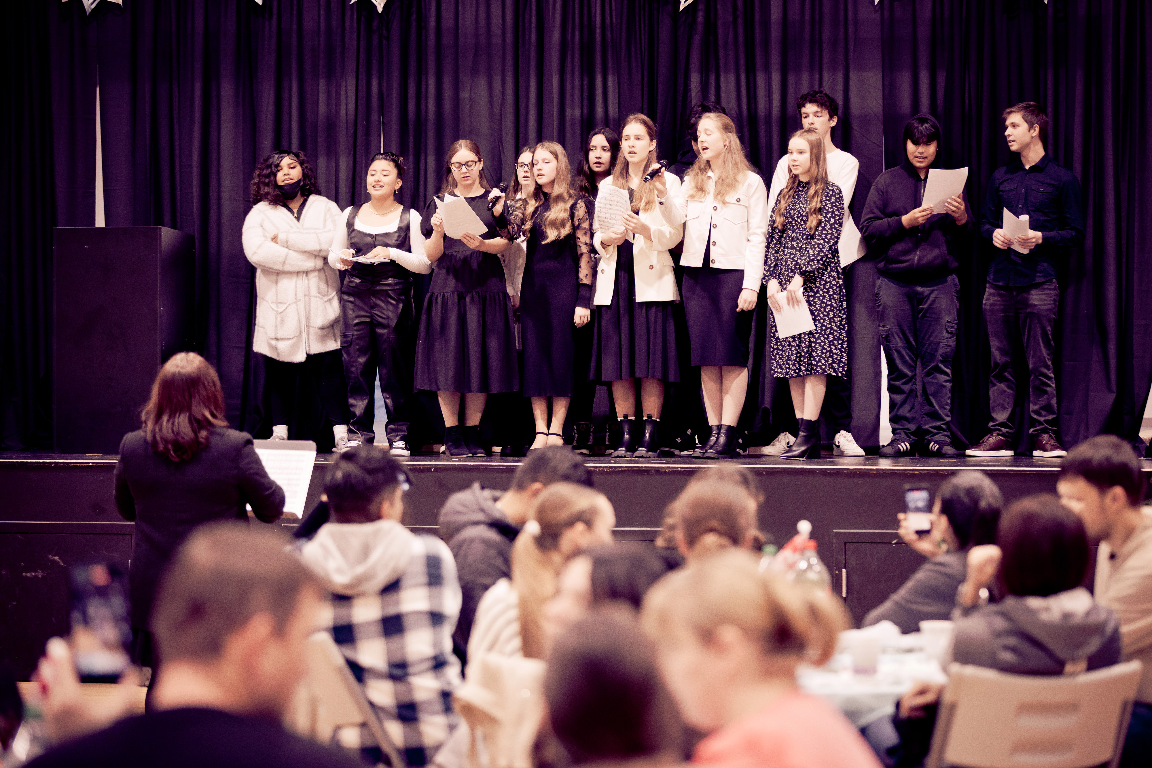 Students singing on stage