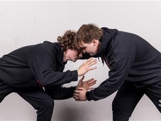 Two wrestling teammates posing