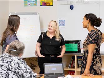 Students and families talking to teachers