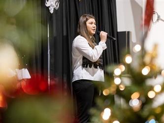 Female student speaking into microphone
