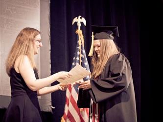Graduate shaking hands