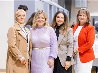 4 women in line for photo