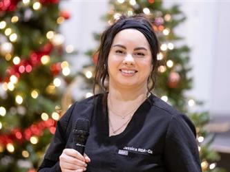 Woman smiling with microphone
