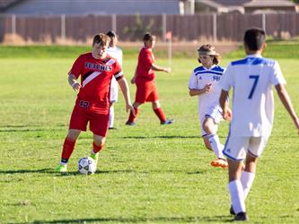 Soccer player dribbling ball