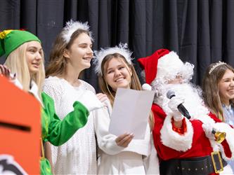 students performing on stage