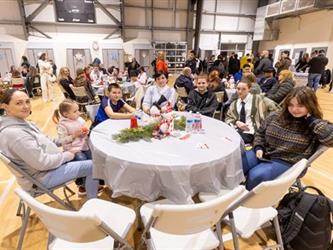 Family at table listening to performance