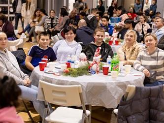 Family at table listening to performance