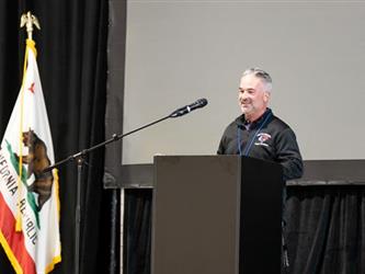 Man presenting at podium