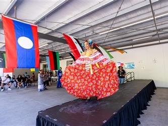 staff member posing on stage