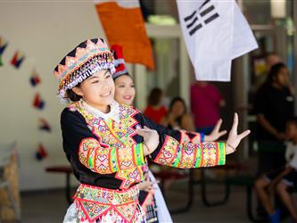 2 students dancing in cultural attire