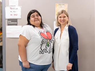 A student is pictured with a teacher 