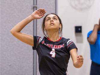 Girl serving ball