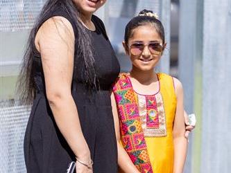 Woman and young girl in sun glasses