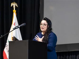 Woman speaking on stage