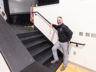 Man getting ready to walk up stairs