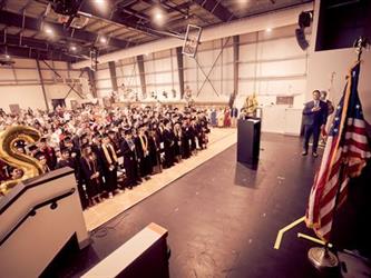 View of audience during graduation in sepia tone