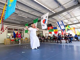 2 students doing traditional dance in cultural dresses