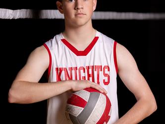 Volleyball player posing with ball