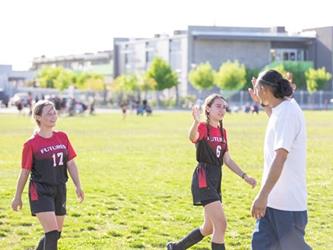 Soccer players in field
