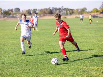 Student kicking ball
