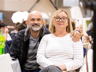 Man and woman smiling for camera