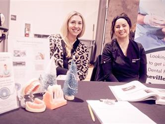 Volunteers sitting at table