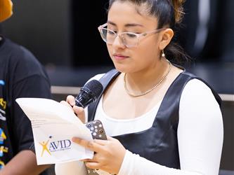 Student speaking into mic