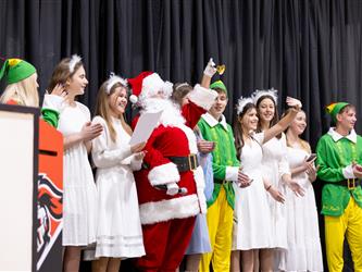 students performing on stage