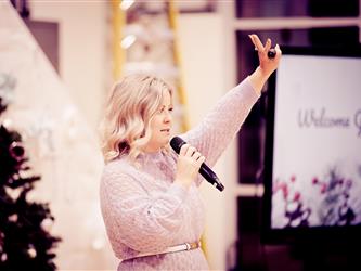 Person speaking and raising hand