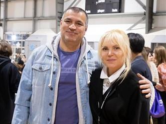 Man and woman posing for camera