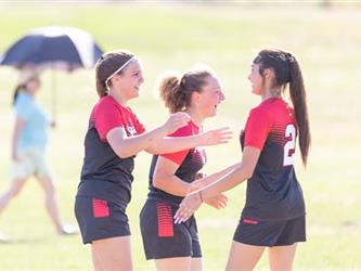 Three soccer players