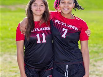 Two teammates posing together