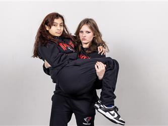 Two wrestling teammates posing