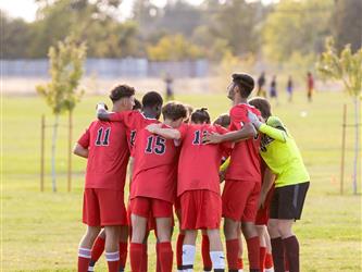 Futures Boy Soccer team in huddle