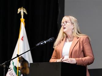 Superintendent speaking at podium