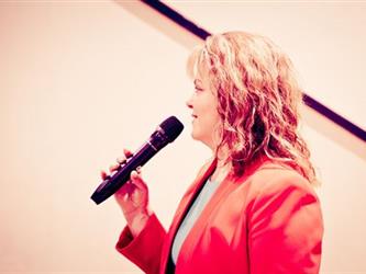 Staff speaking into microphone