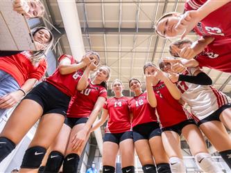 Futures Girls Volleyball team in huddle