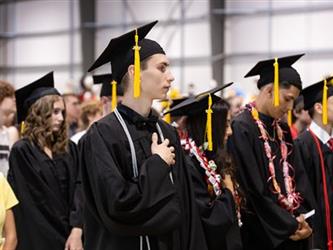Grads saluting the flag
