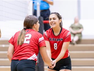 Futures Girls Volleyball team low five