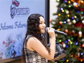 students performing on stage