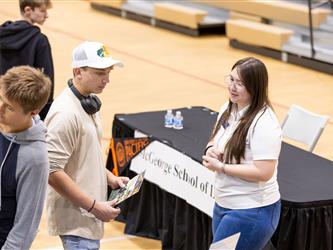 college recruiter talking to student
