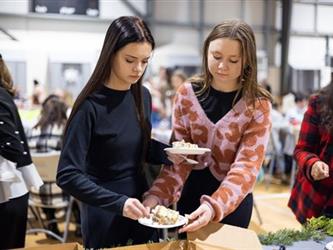 Two women getting a snack