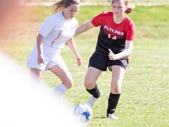 Soccer players in field