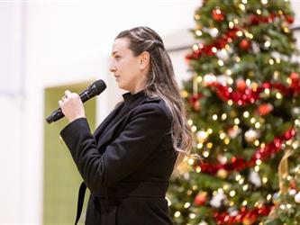 Woman speaking into microphone