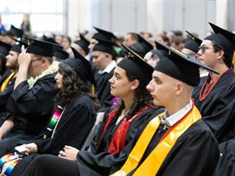 Grads listening to principal