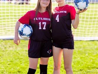 Two players with soccer balls