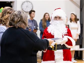 student shaking speakers hand 