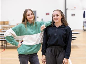 2 girls posing for photo