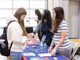 Students speaking with recruiters