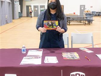 Recruiter at table in gym